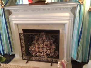 How innovative was Gary McBournie Inc.? Clever using conch shells in the fireplace for a Caribbean Island Holiday.